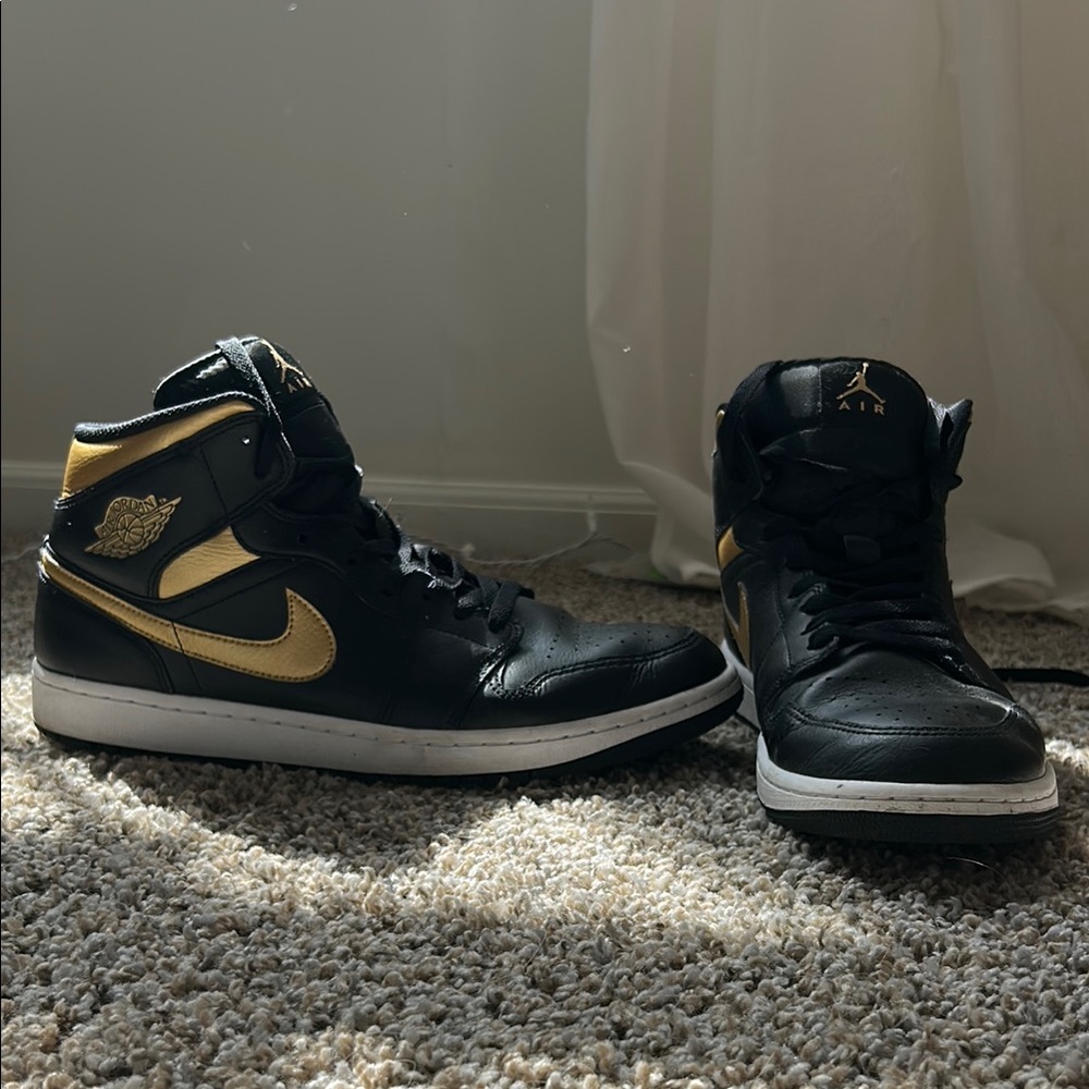 Air Jordan Black and Gold High-Top Sneakers